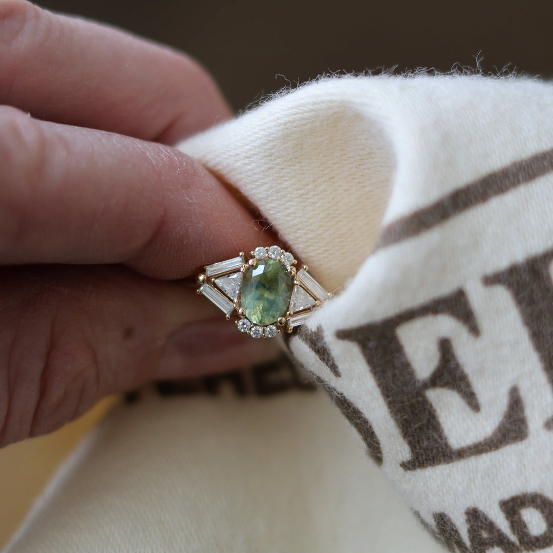 Fine gold jewelry being cleaned with a soft cloth