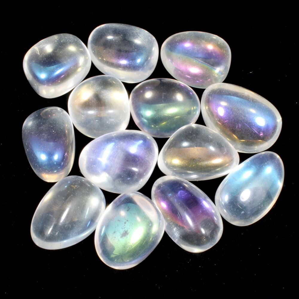 A collection of polished Angel Aura Quartz tumblestones with a striking rainbow effect