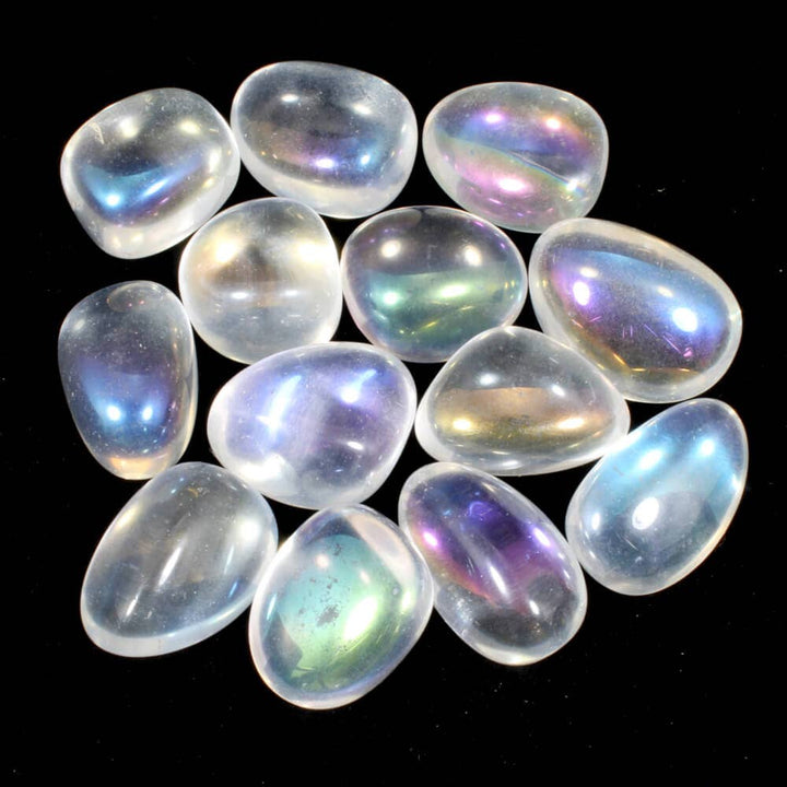 A collection of polished Angel Aura Quartz tumblestones with a striking rainbow effect