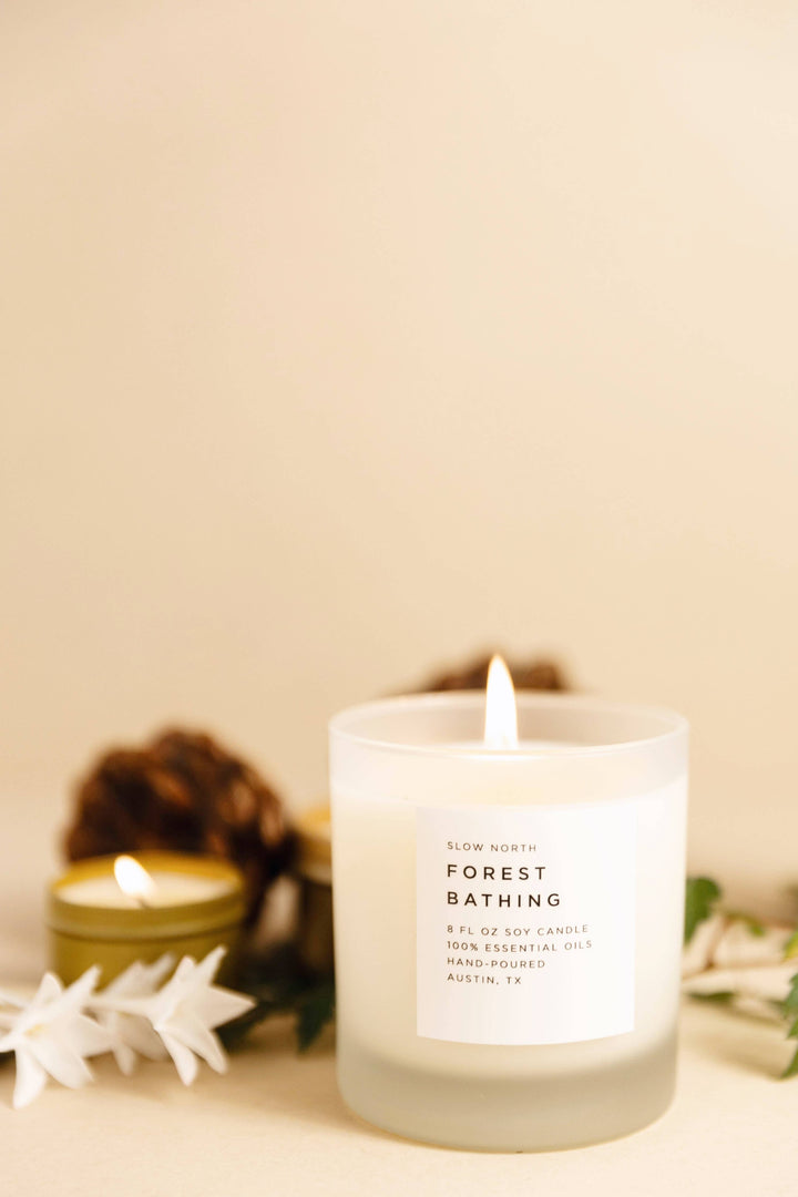 Candle labeled 'Forest Bathing' with a beige background