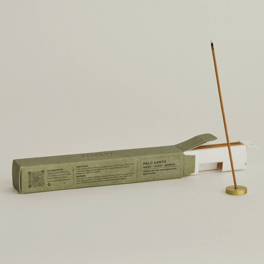 Palo Santo incense stick with packaging on a light gray background