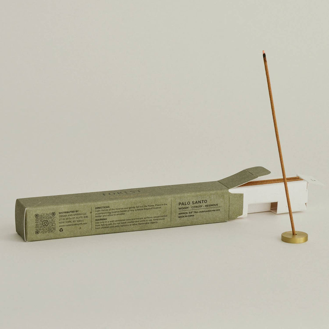 Palo Santo incense stick with packaging on a light gray background