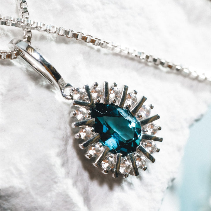 Silver pendant with london blue topaz stone
