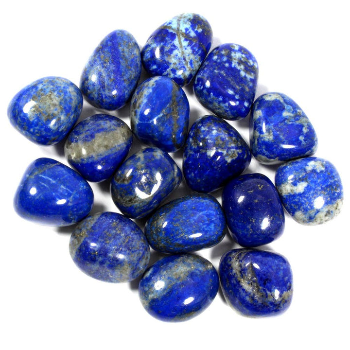 A collection of polished lapis lazuli tumblestones, displaying a deep blue color with natural mineral patterns.