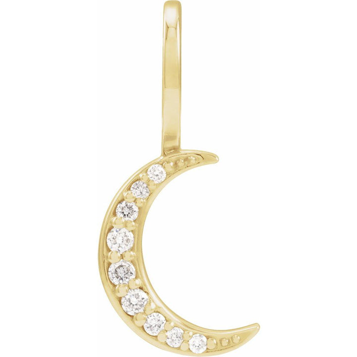 Gold crescent moon pendant with embedded diamonds on a white background