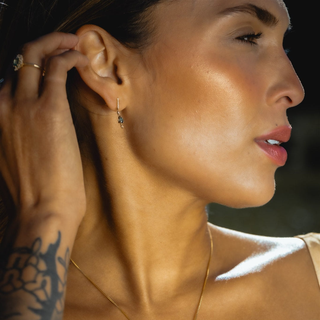 Close-up of a woman wearing an earring with a blurred background