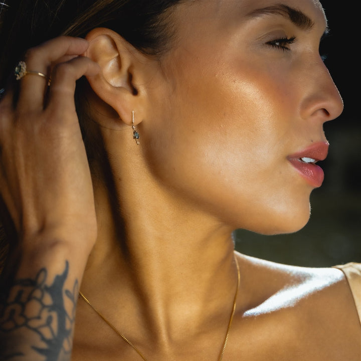 Close-up of a woman wearing an earring with a blurred background