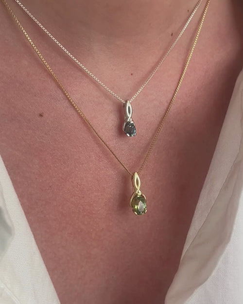 Video: two Talismania pendants worn layered in solid 14K white and yellow gold with Montana sapphires — Talismania