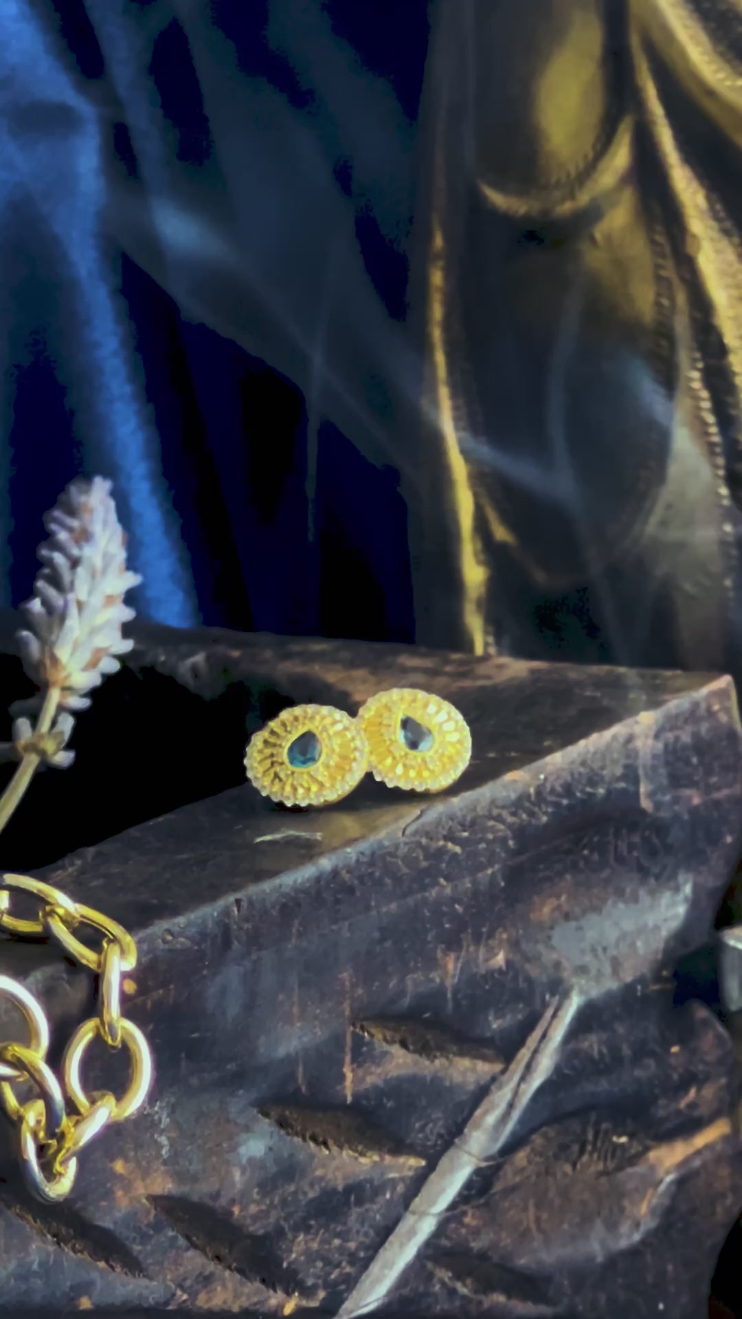 Gold gemstone talisman symbol earrings in mystical settling