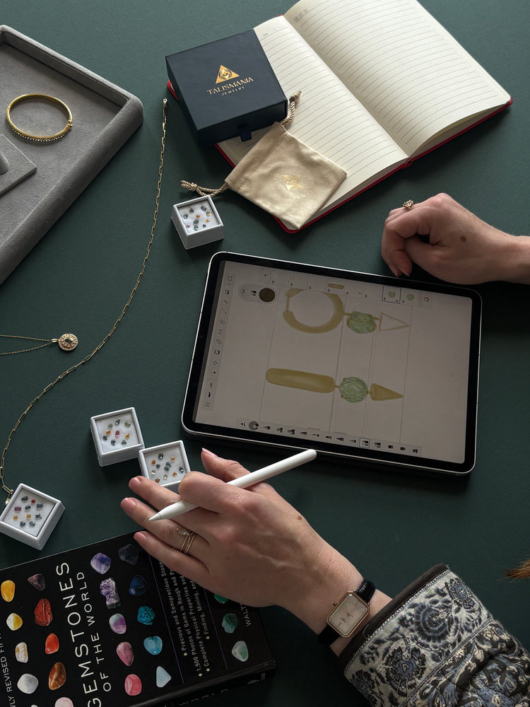 The Talismania studio desk in Red Lodge, with a jewelry sketch, sapphire boxes and gold pieces