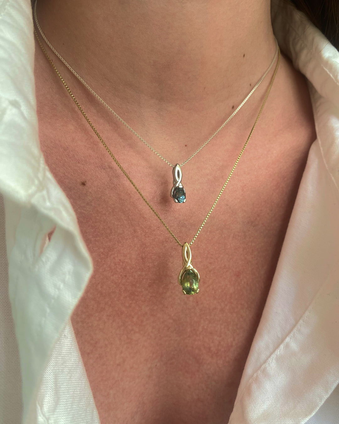 Talismania pendant in solid 14K yellow gold with an oval green Montana sapphire, worn on a box chain — Talismania