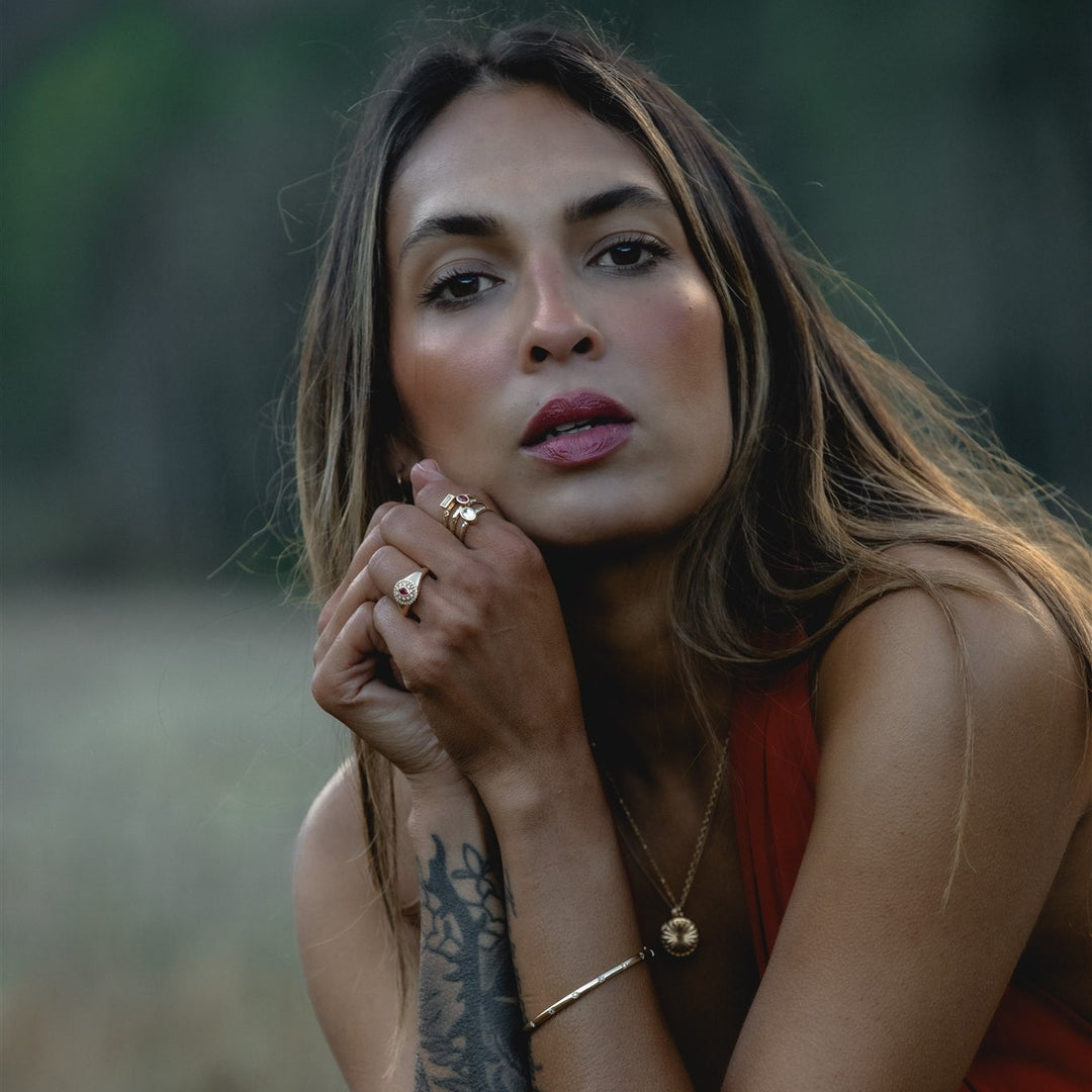 Model wearing Talismania Wildfire jewelry in solid 14K gold with lab-created rubies — Talismania